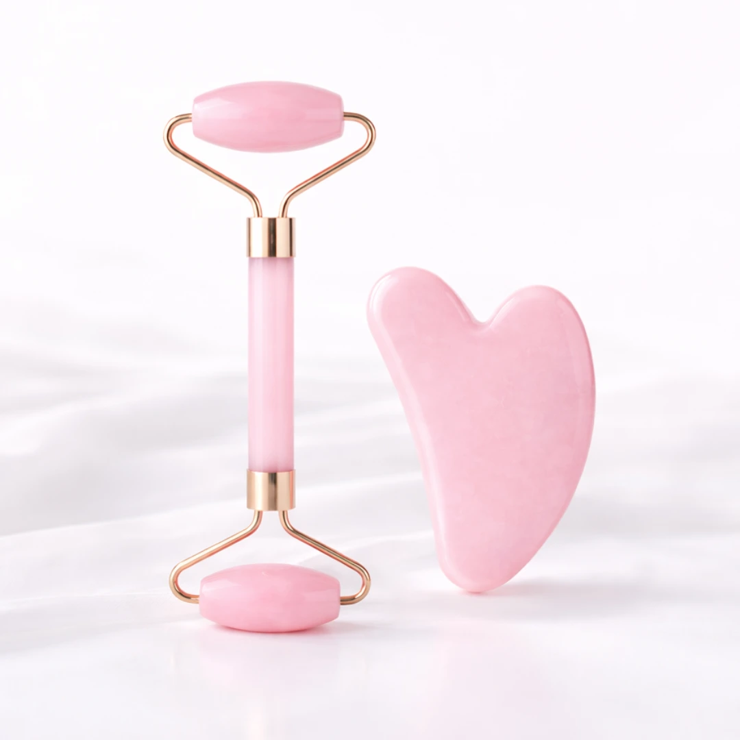 pink jade facial roller and gua sha massage tool isolated on white background for quality home essentials at westfordliving